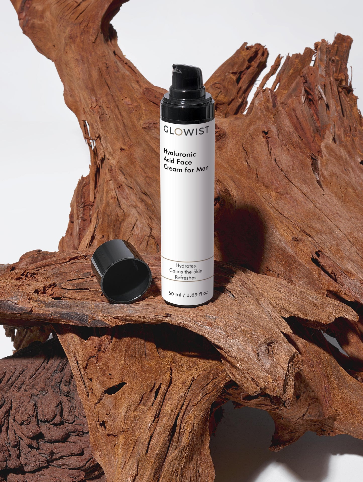 Glowist face cream bottle on a wooden surface